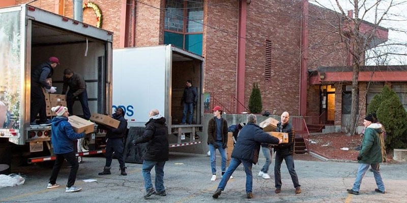 Volunteers loading supplies onto a truck